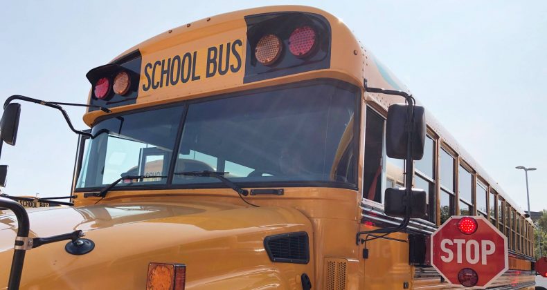 school bus with stop arm out