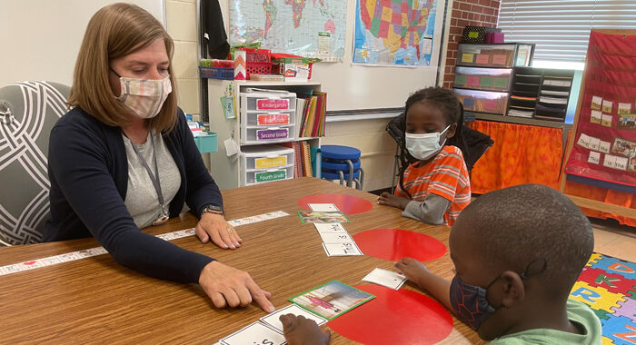 Teacher works with ELL students