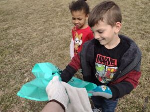 Students pick up trash on school grounds