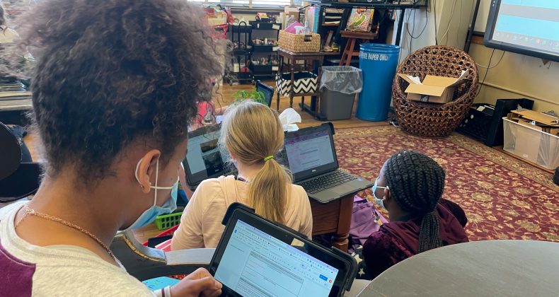 Students in classroom with Chromebooks