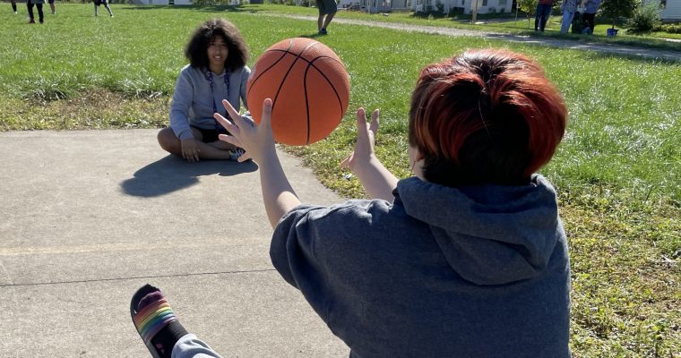 Students passing a basketball