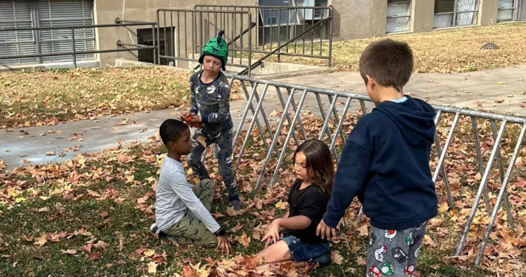 Cleveland students playing in leaves 2024