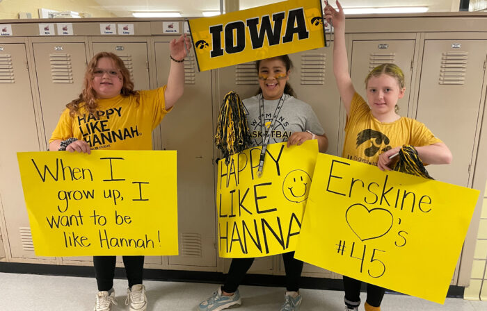 Students hold up supportive signs of Hannah Stuelke