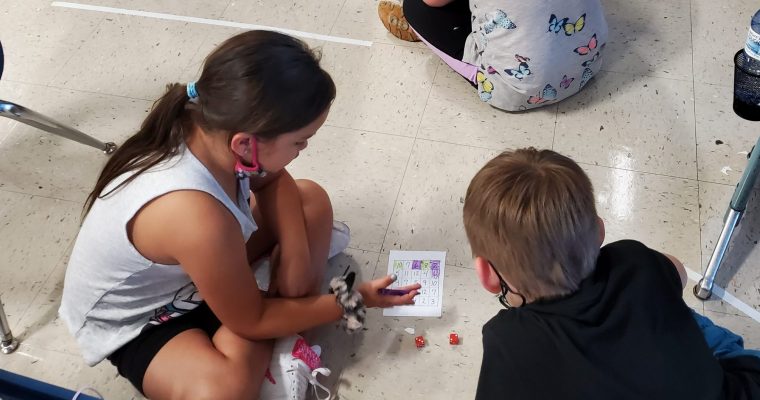 Students playing a math game with partners