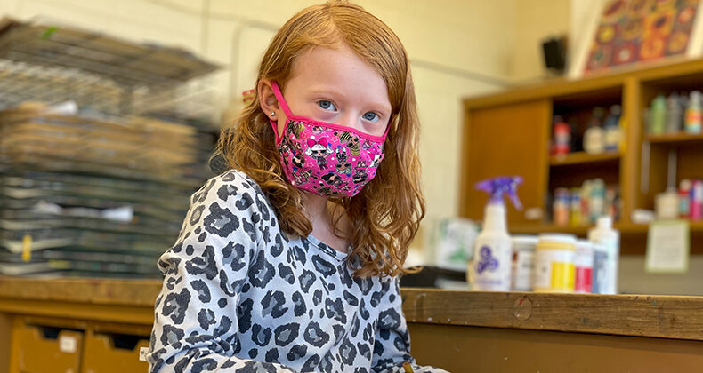 student wearing mask in classroom