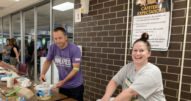 OUr band parents help serve meals for band camp.
