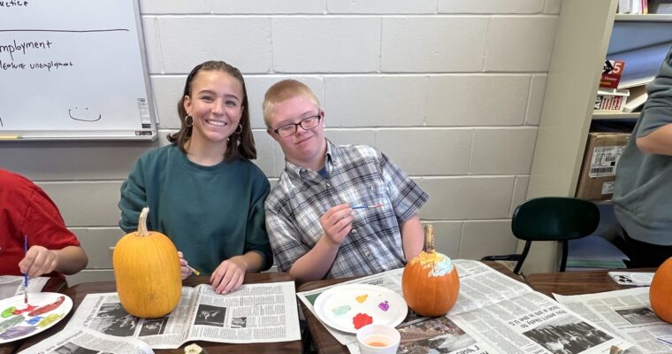 Student Government and the Circle of Friends decorate pumpkins for Halloween