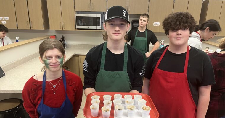 students prepare chili variations for tasting