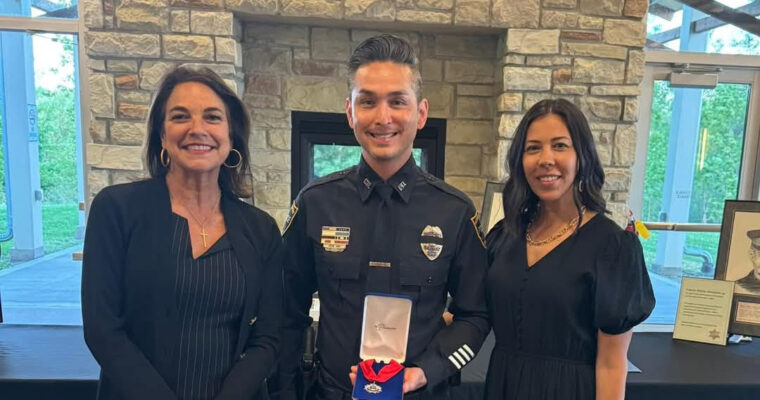 Kennedy's SRO, Officer Tran, receives the medal of valor.