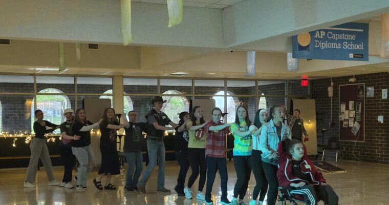 Best Buddies doing a conga line