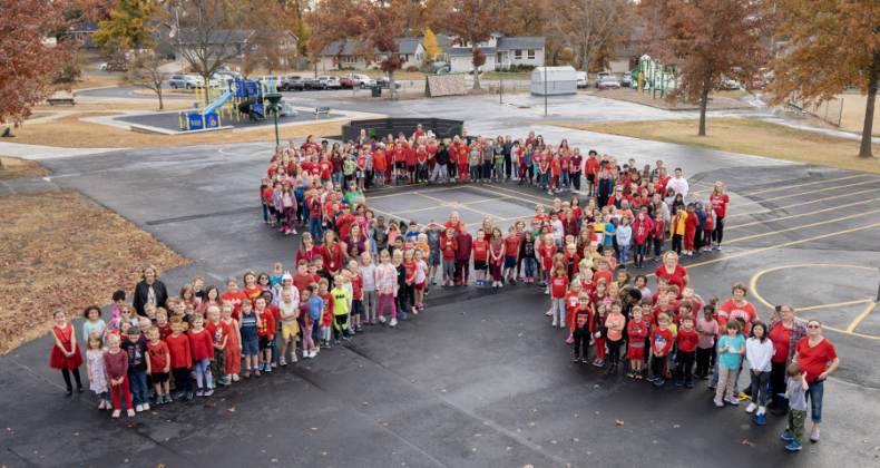 Pierce elementary students form a ribbon on the playground.