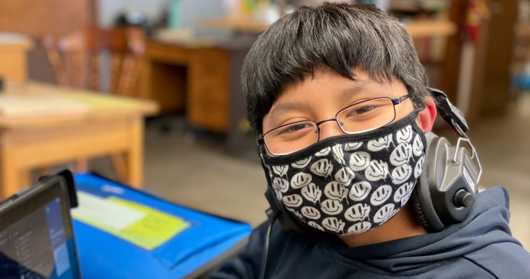 Student smiling with mask