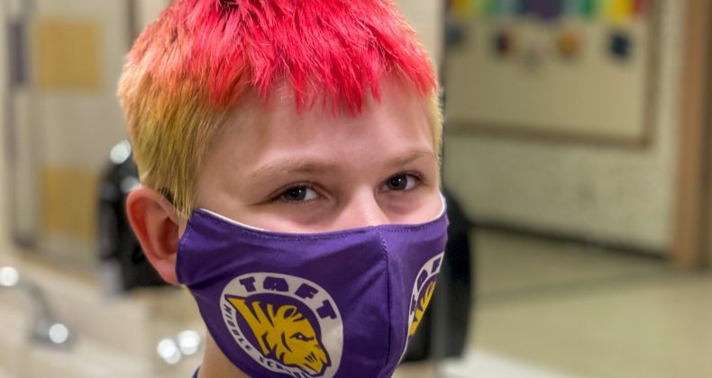 Student with Taft mask