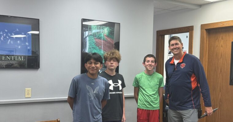 Coach and runners of the 8th grade boys cross country team