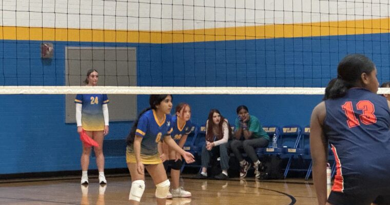 8th grade volleyball players waiting for a serve